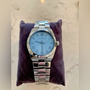 Silver Michael Kors watch with light blue face